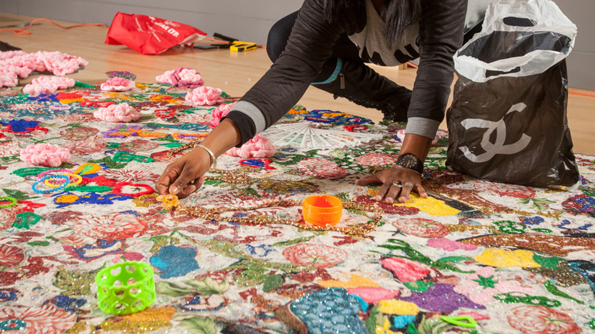 Ebony G. Patterson installing the exhibition Ebony G. Patterson: Dead Treez at the John Michael Kohler Arts Center, 2015