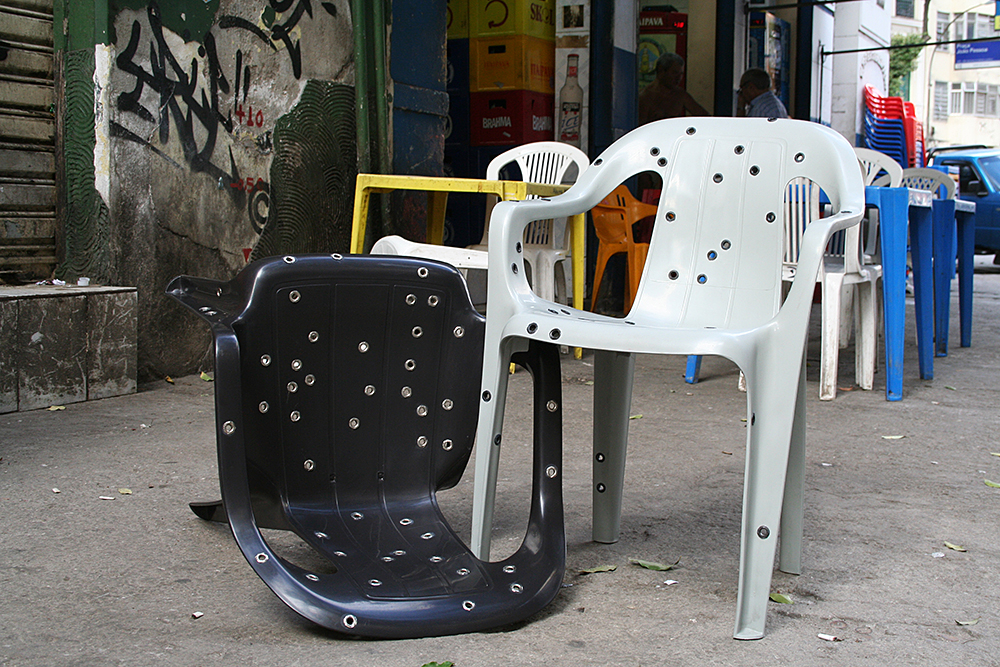 Design da Gema, Stray Bullet Chair (2011): Polypropylene monobloc chair, stainless steel eyelets. Courtesy of the artist. Brazil. Photo by David Elia.